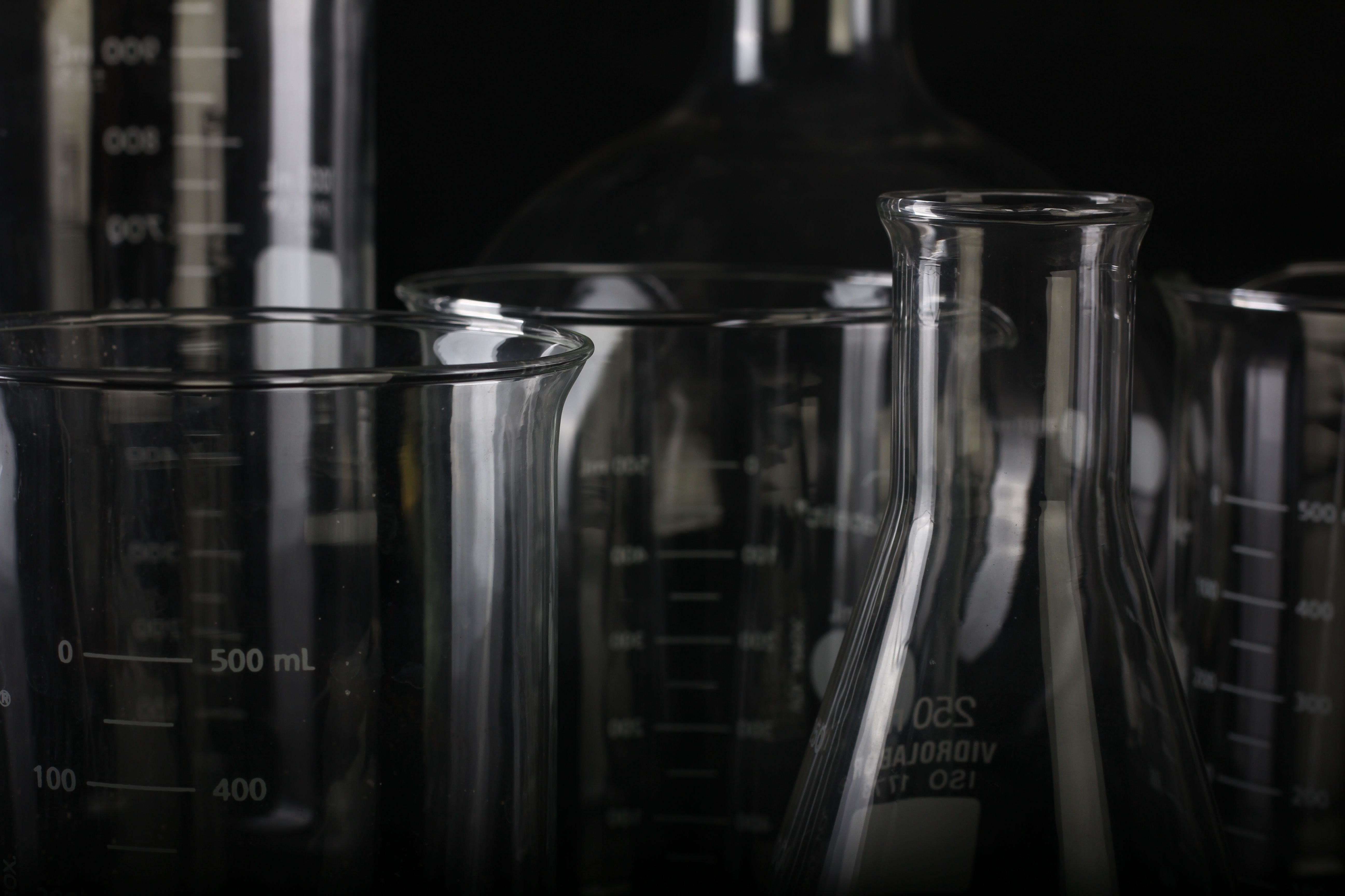Orange crystalline chemical compound in a laboratory environment