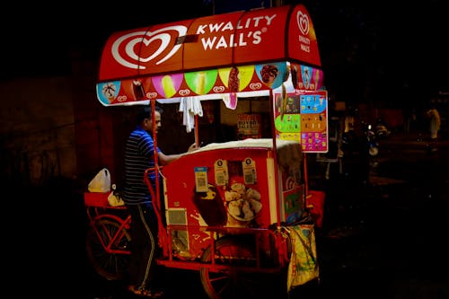 A Man Selling Ice Cream at Night 