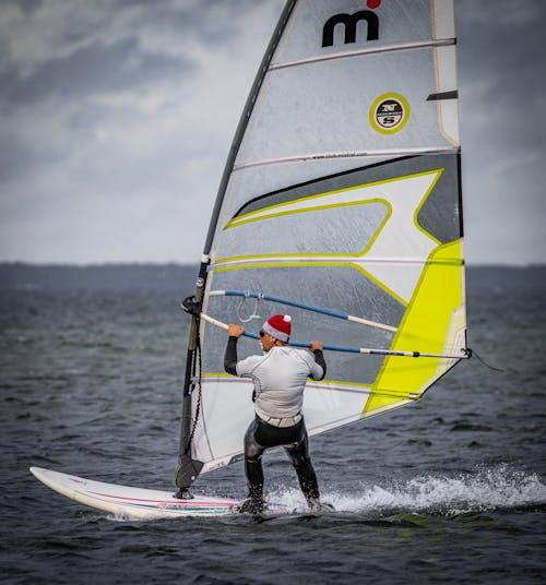 A Person Windsurfing on Sea