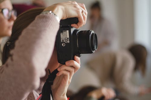 Person Using Black Camera 