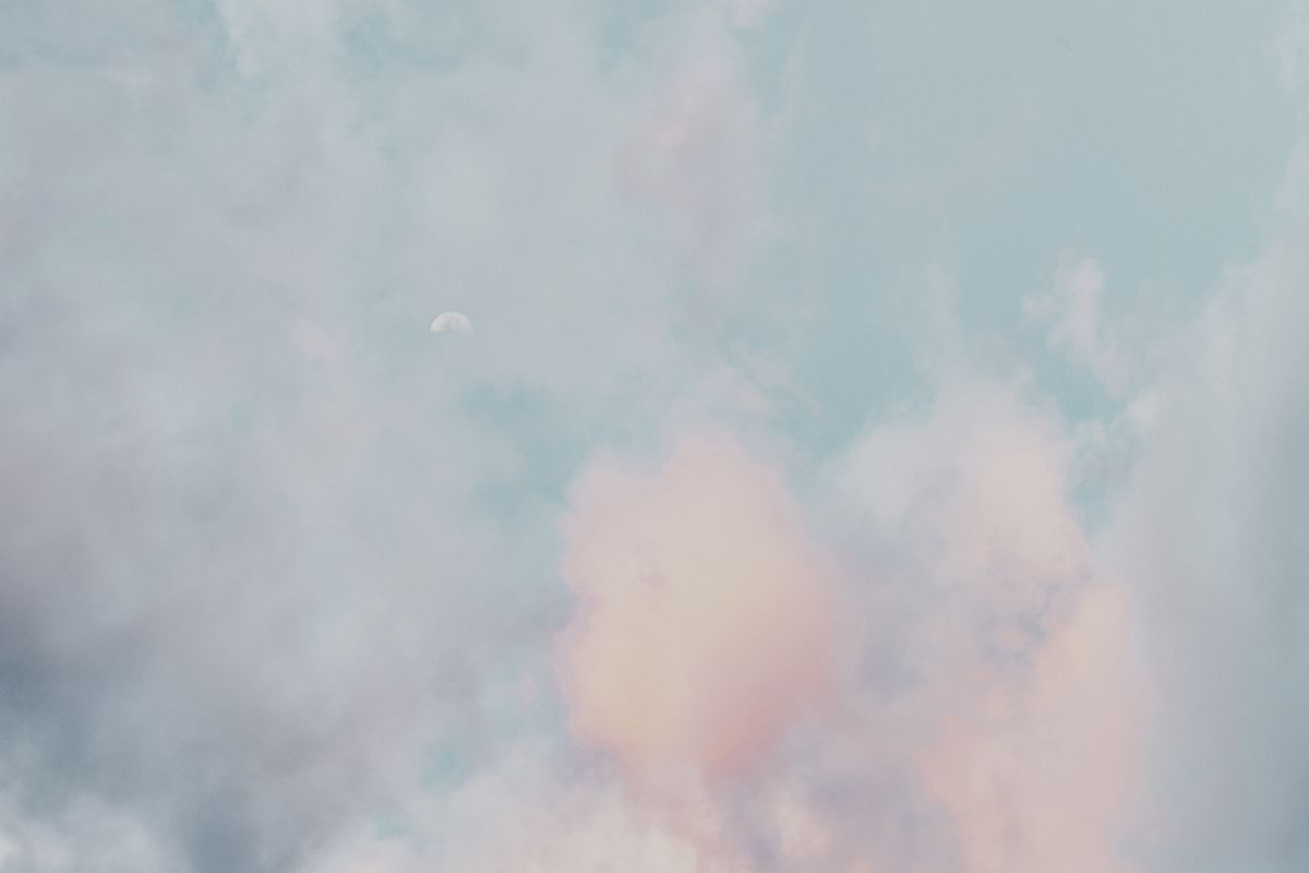 Pastel clouds and a subtle moon in a calm sky — eberhard grossgasteiger on Pexels