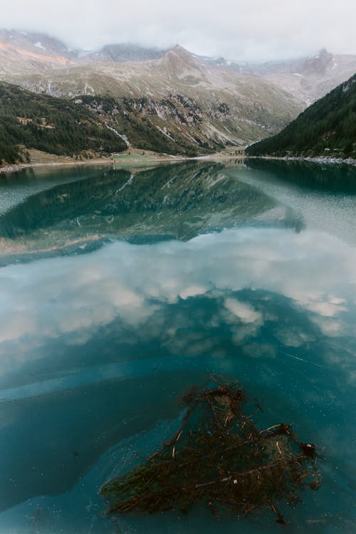 Free Body Of Water Near Mountain Stock Photo