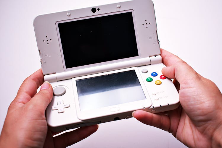 Person Holding Nintendo Ds