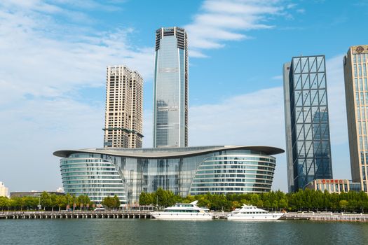 A scenic view of a modern urban skyline featuring unique architectural high-rise buildings.