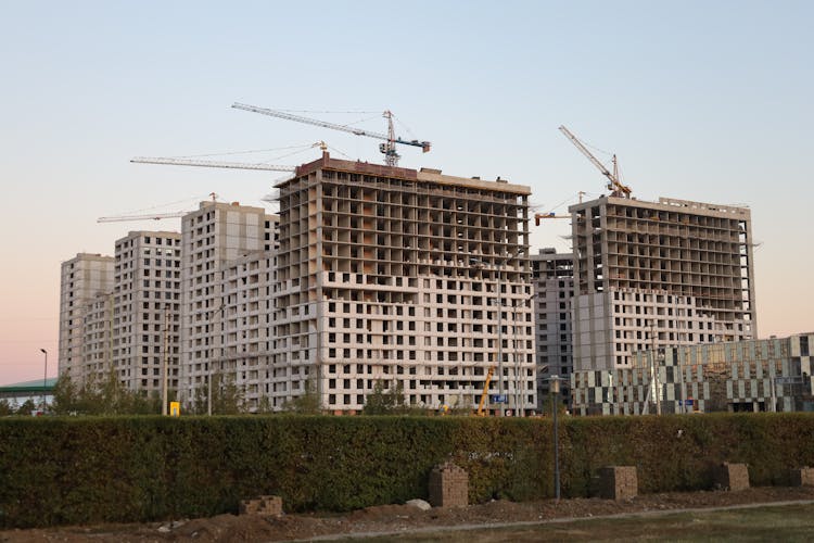 White And Brown Concrete Buildings Under Construction