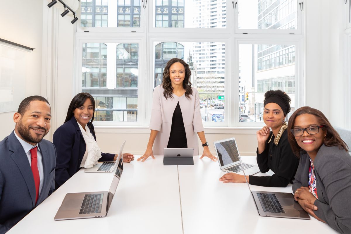 Multicultural leadership team collaborating in a meeting room