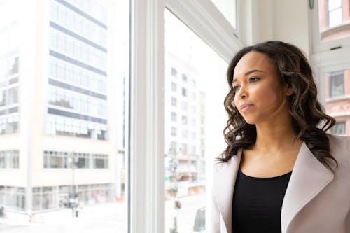 Free Woman Looking At The Window Stock Photo