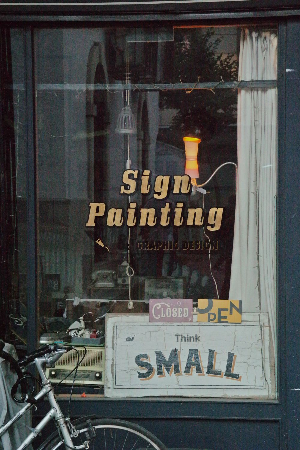 Illuminated retail storefront 3D fascia signboards, custom acrylic lettering, and architectural store branding