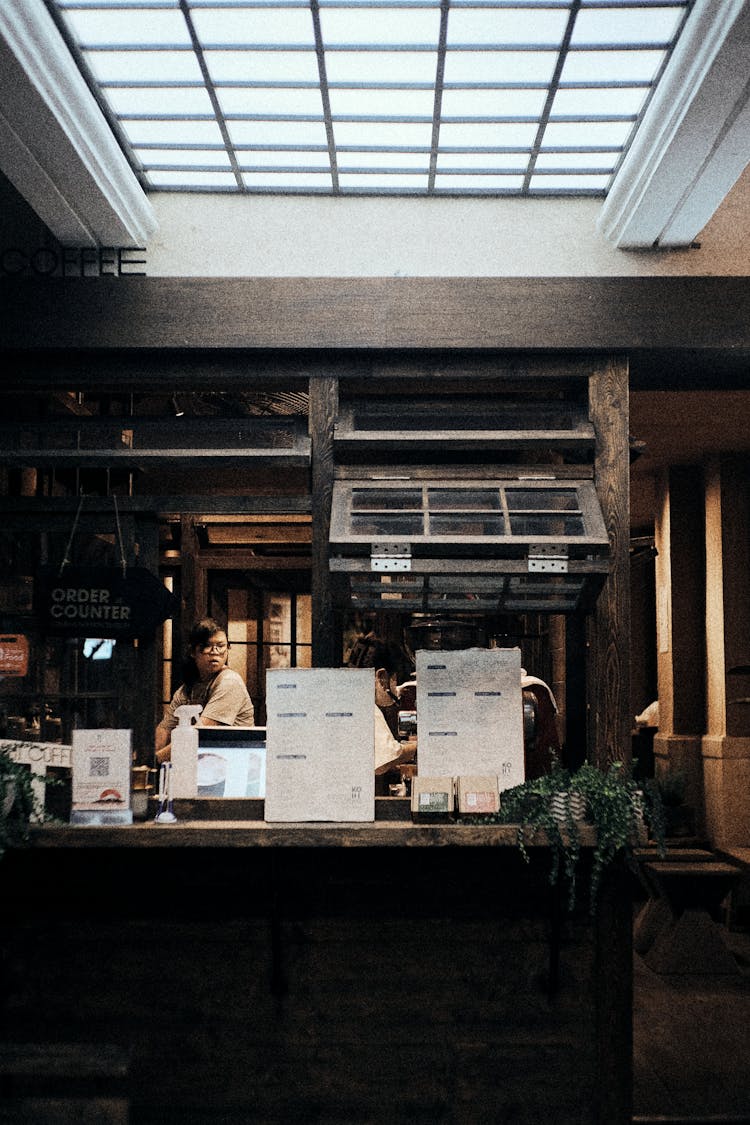 A Woman Behind Cafe Counter