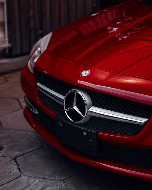 A Mercedes Emblem on a Red Sports Car 