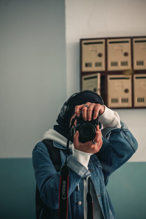 Portrait of Woman Taking Picture with Camera