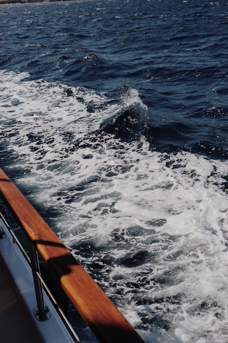 Ocean  Waves Beside Brown Boat