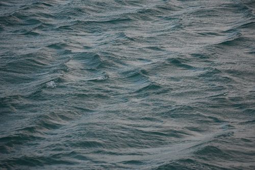 Free Gentle ocean waves in Monopoli, Puglia, create a serene seascape. Stock Photo