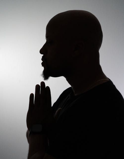 Silhouette of Man Praying 