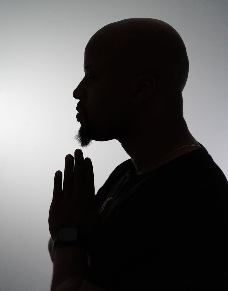 Silhouette Of Man Praying 