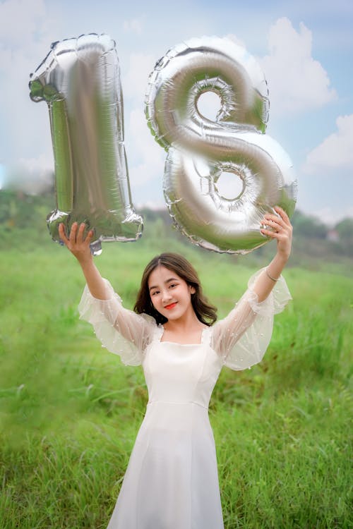 Free Teenage Girl Holding Balloons Stock Photo