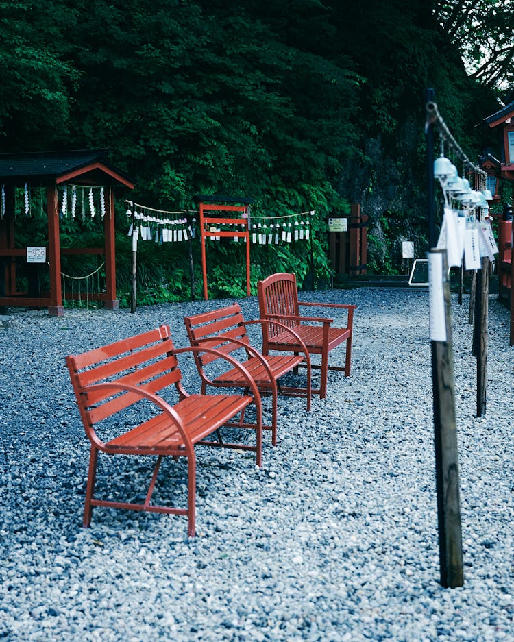 Red Benches On A Park