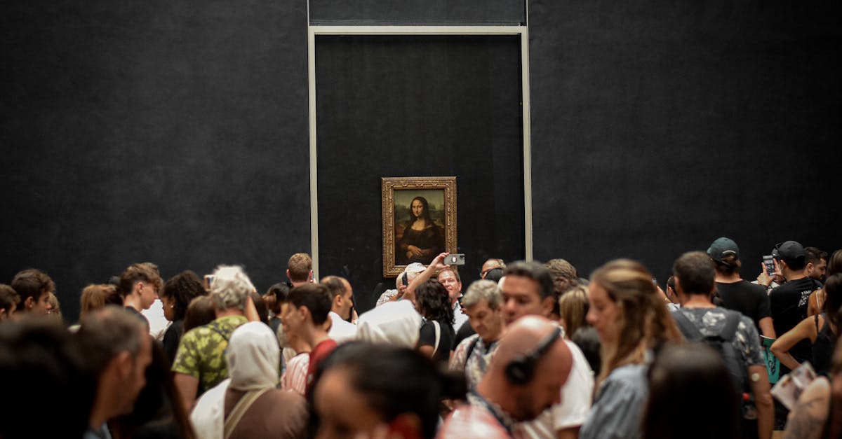 Mona Lisa At The Louvre Museum With Crowds And Smartphones