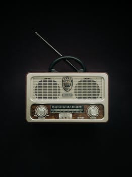 Classic vintage radio with a black background, featuring retro design elements.