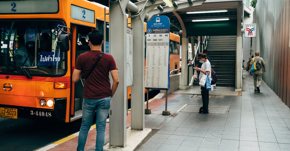 People Waiting Anxiously At A Train Station Or Bus Stop, Looking At Their Watches, With A Sense Of Urgency And Discomfort