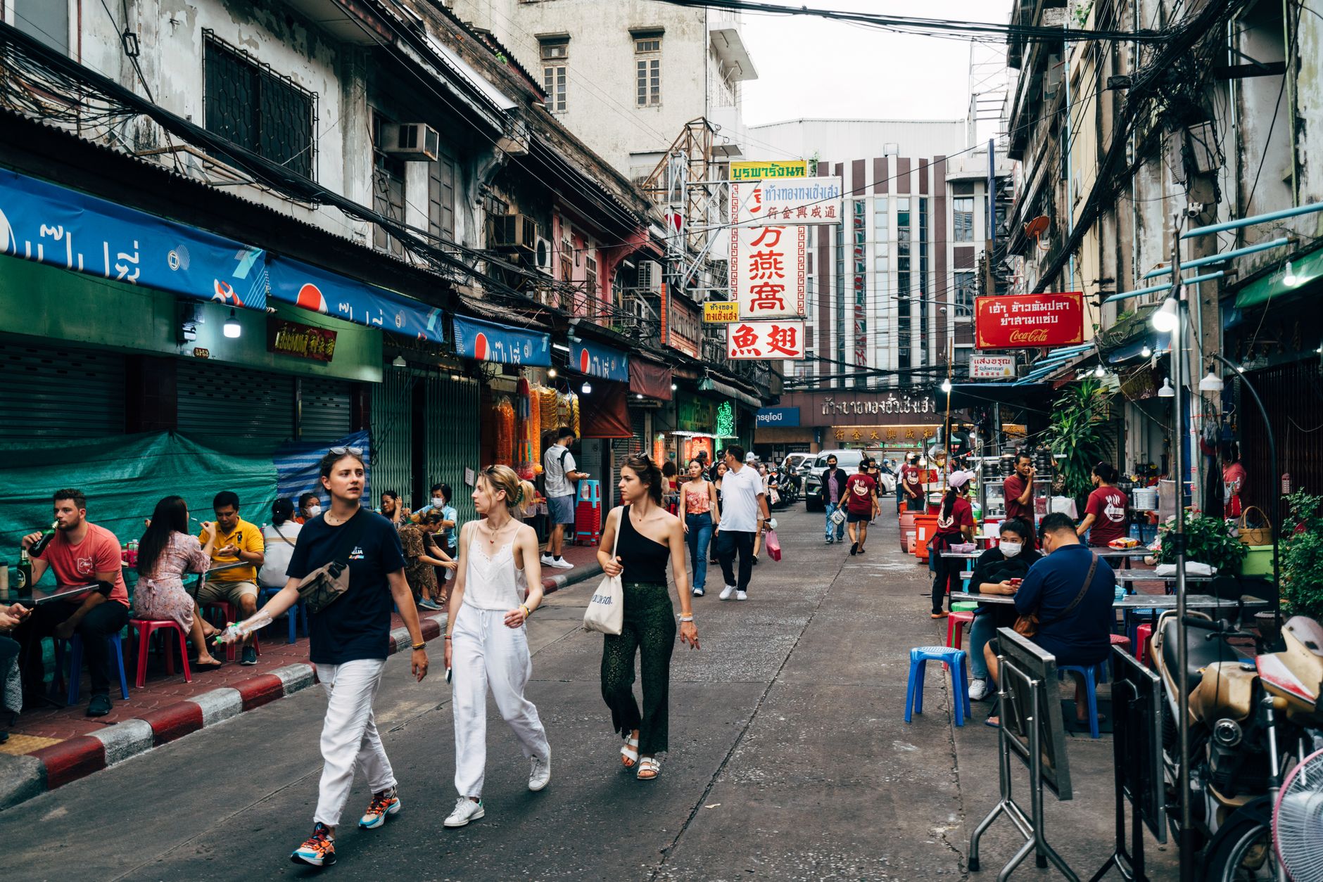 Neon-lit food stalls on Yaowarat Road in Bangkok's Chinatown