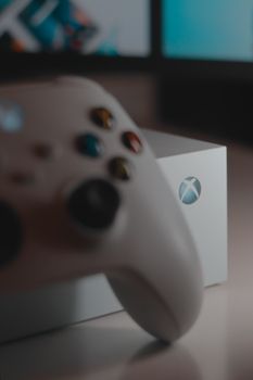 A detailed view of a white game controller and console, ideal for gaming enthusiasts.