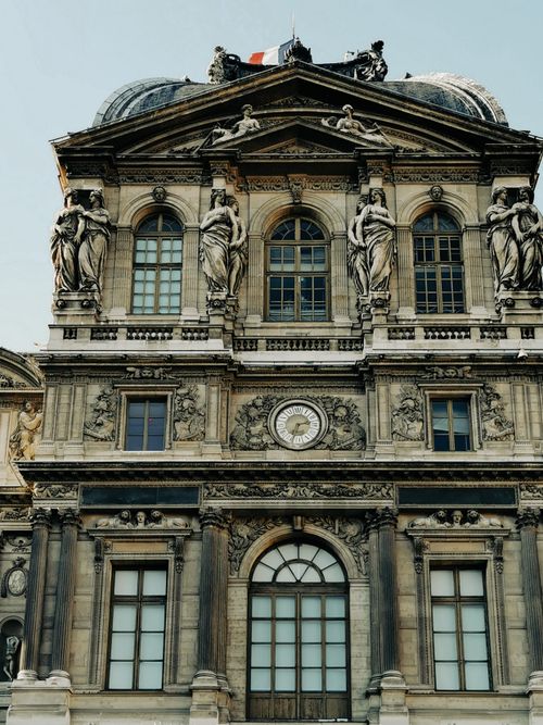 Free Historic architectural facade of Pavillon de l'Horloge, Paris, showcasing baroque design and sculptures. Stock Photo
