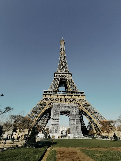 Free Iconic Eiffel Tower in Paris captured on a clear sunny day, a must-see landmark. Stock Photo