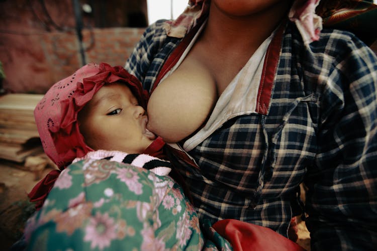 Mother Feeding With Breast