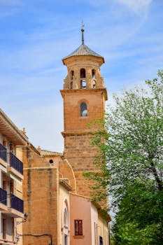 Captivating view of a historic church tower in Caravaca de la Cruz, Spain, showcasing architectural beauty.
