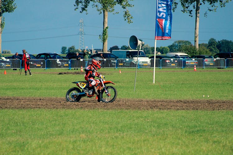 Man Riding Motorbike In Field