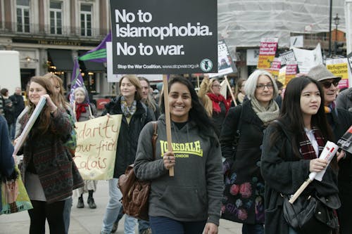 Smiling Women Protesting with Signs