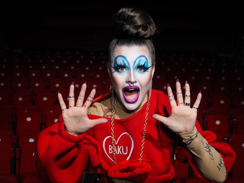 Eccentric Woman with Bright Makeup in Theater