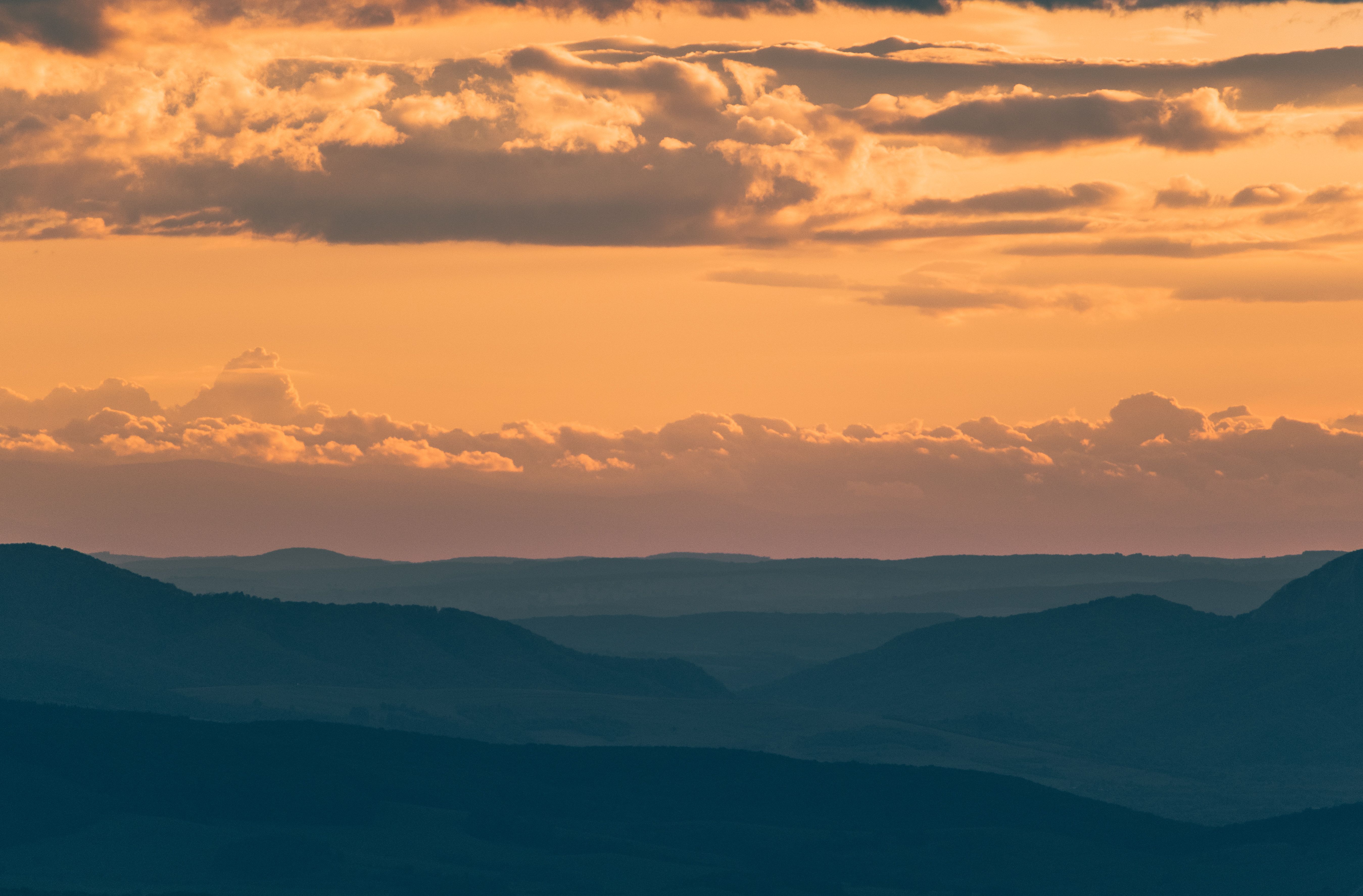 Silhouette of Mountains during Sunset · Free Stock Photo