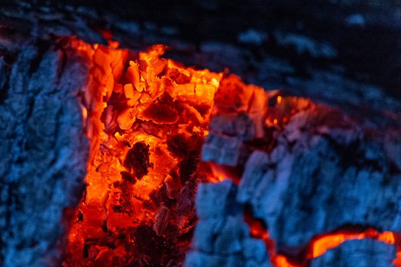 Embers glowing inside charred wood — photo by Free Nature Stock on Pexels