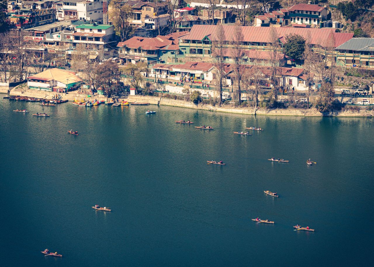 Naini Lake from above, with boats and the town around its shore