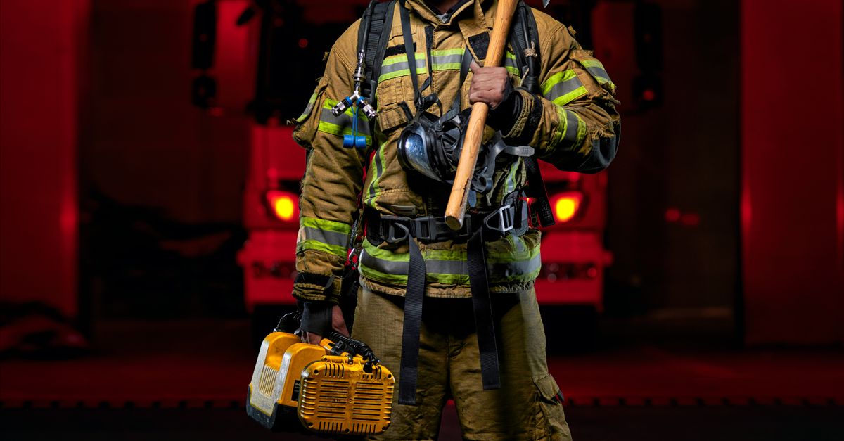 Firefighter In Uniform Posing At Station Free Stock Photo firefighter-in-uniform-posing-at-station-free-stock-photo