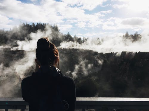Free Woman Looking At Foggy Mountain Stock Photo