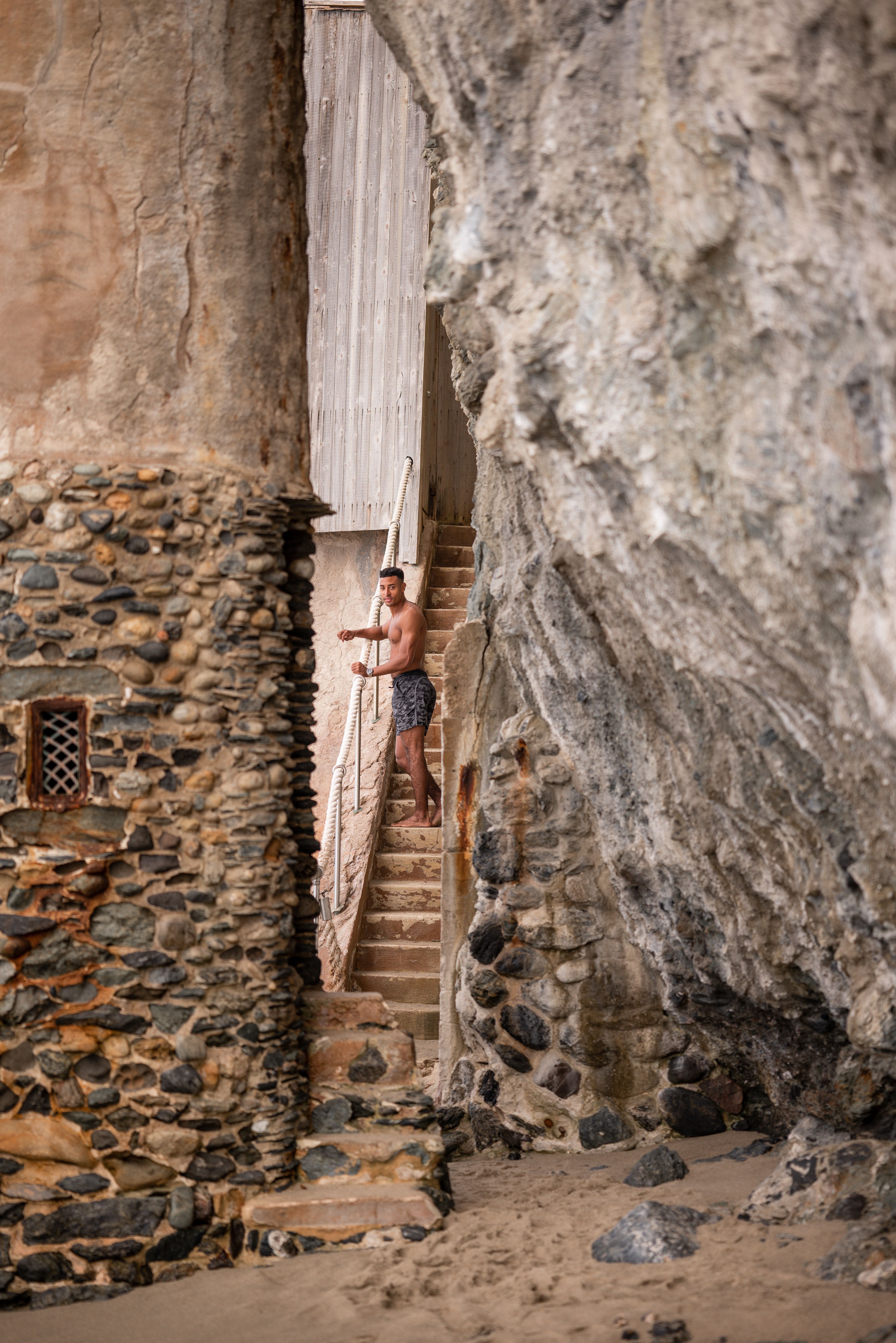 A Man Exploring a Castle on the Beach · Free Stock Photo