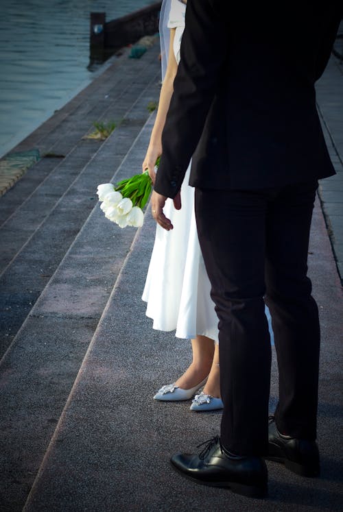 A Man and a Woman Standing on the Stairs