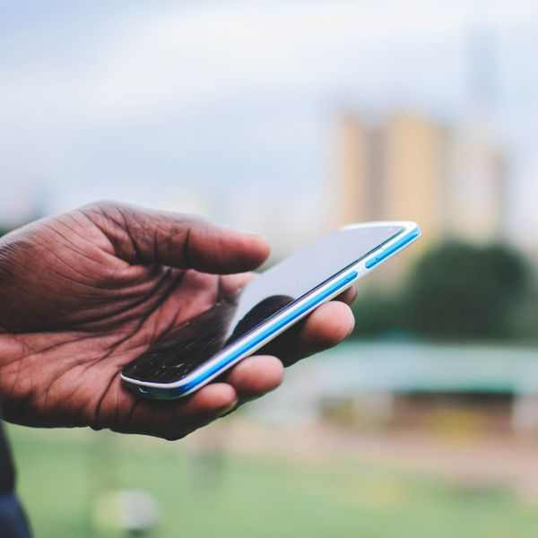 Hand holding a smartphone — photo by Mwabonje Ringa on Pexels