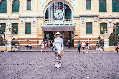 Free Woman Standing In Front Of Building Stock Photo