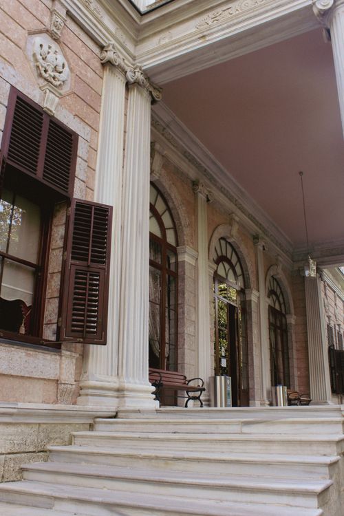 Free Elegant entrance of a historic pavilion featuring arched windows and classic columns in Istanbul. Stock Photo