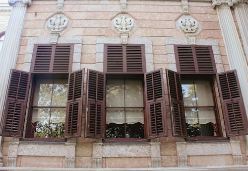 Wooden Shutters on the Window of a Concrete Structure