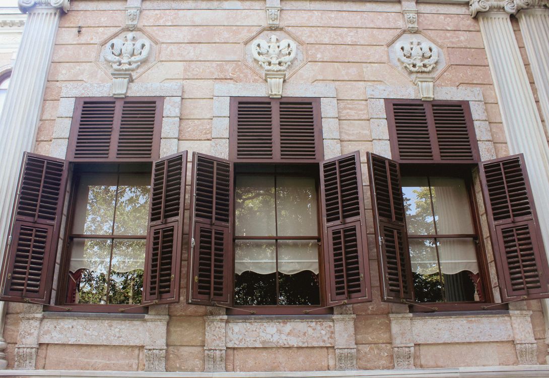 Shutter In Building Wooden Shutters on the Window of a Concrete Structure · Free Stock Photo