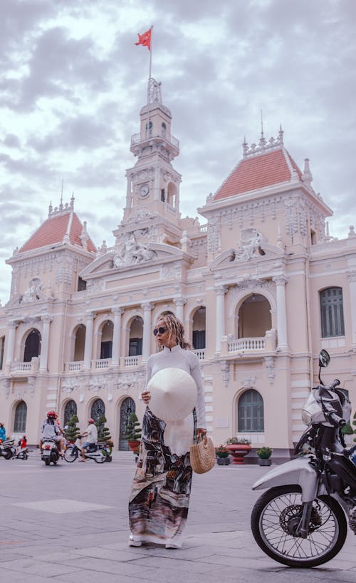 Free Woman Standing Beside Motorcycle Stock Photo