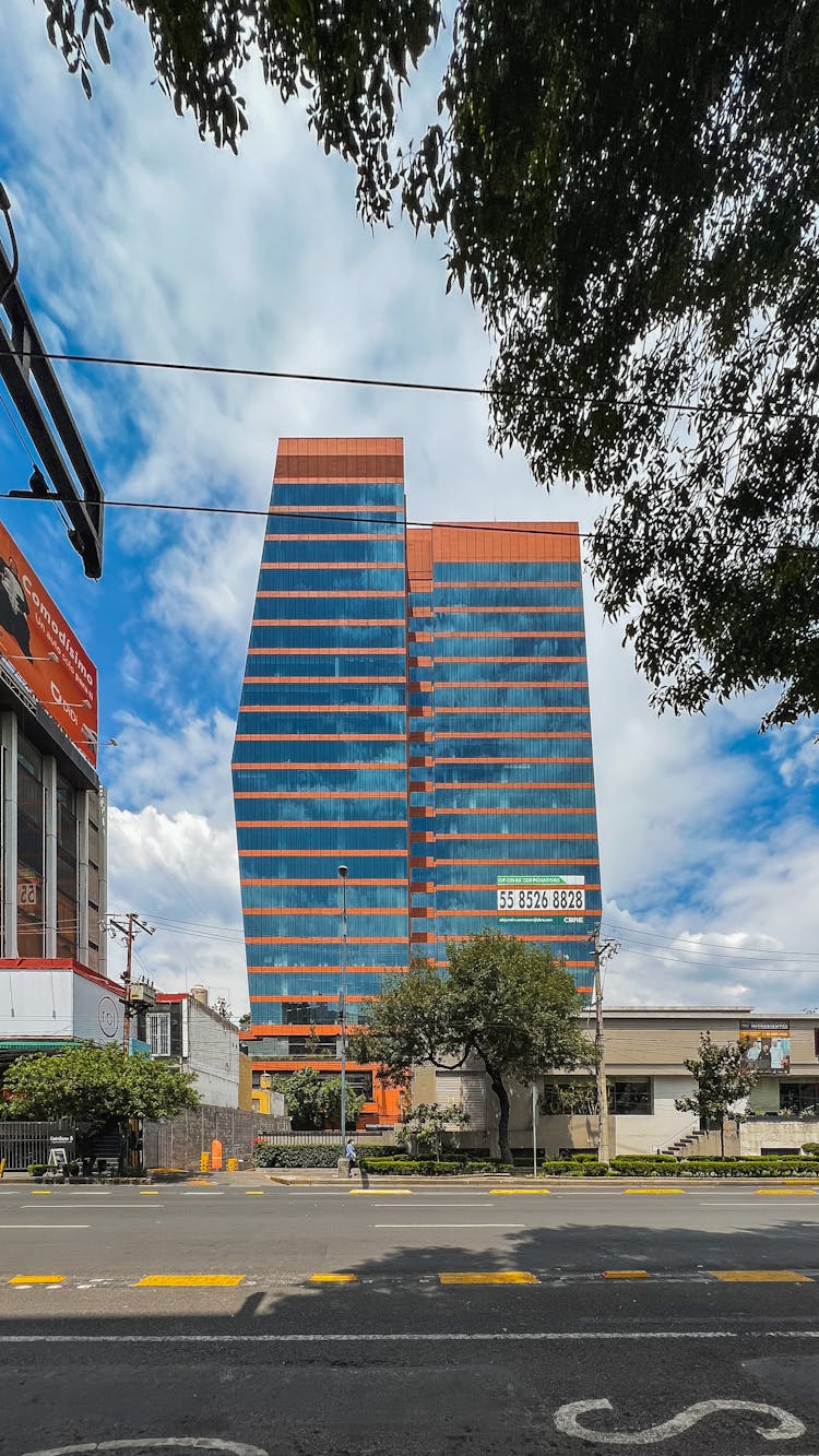 Glass Building Under White Clouds 