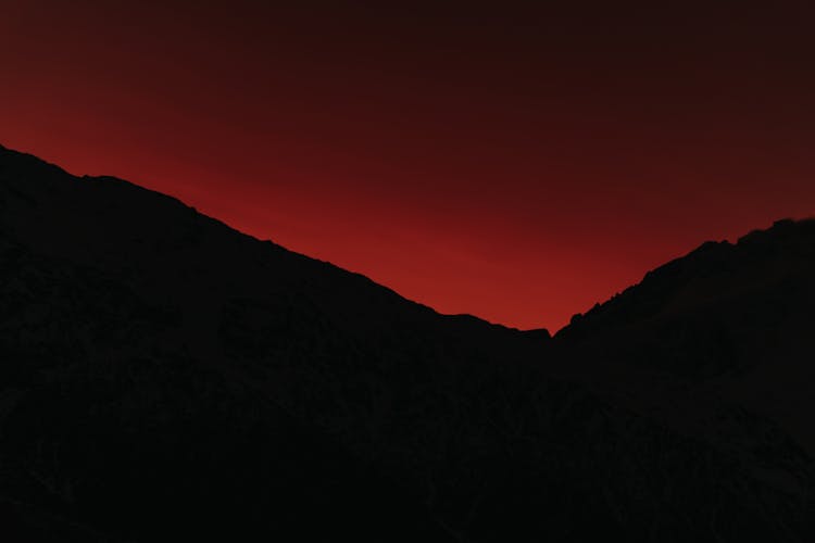 Silhouettes Of Mountains At Red Dusk