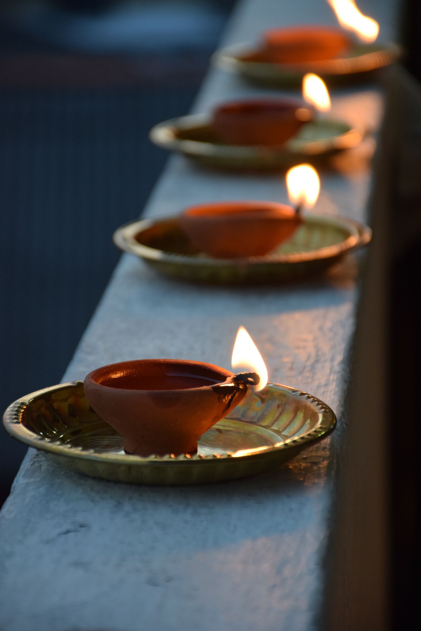 A lit diya in close-up.