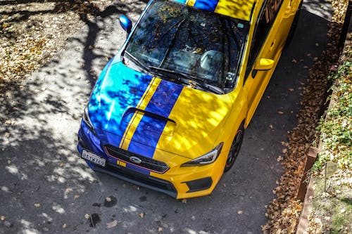 Free A Blue and Yellow Car  Stock Photo